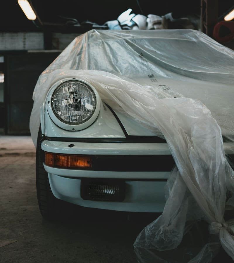 A classic Porsche wrapped in plastic for paint